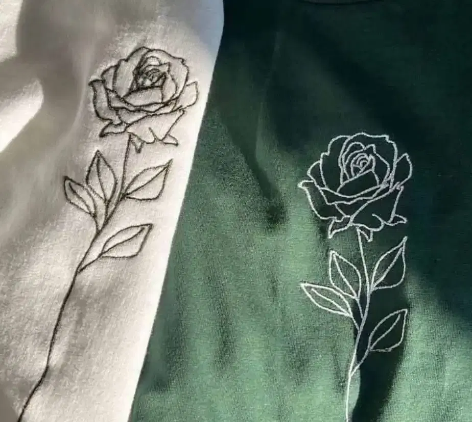 Precision embroidery rose design on fabric